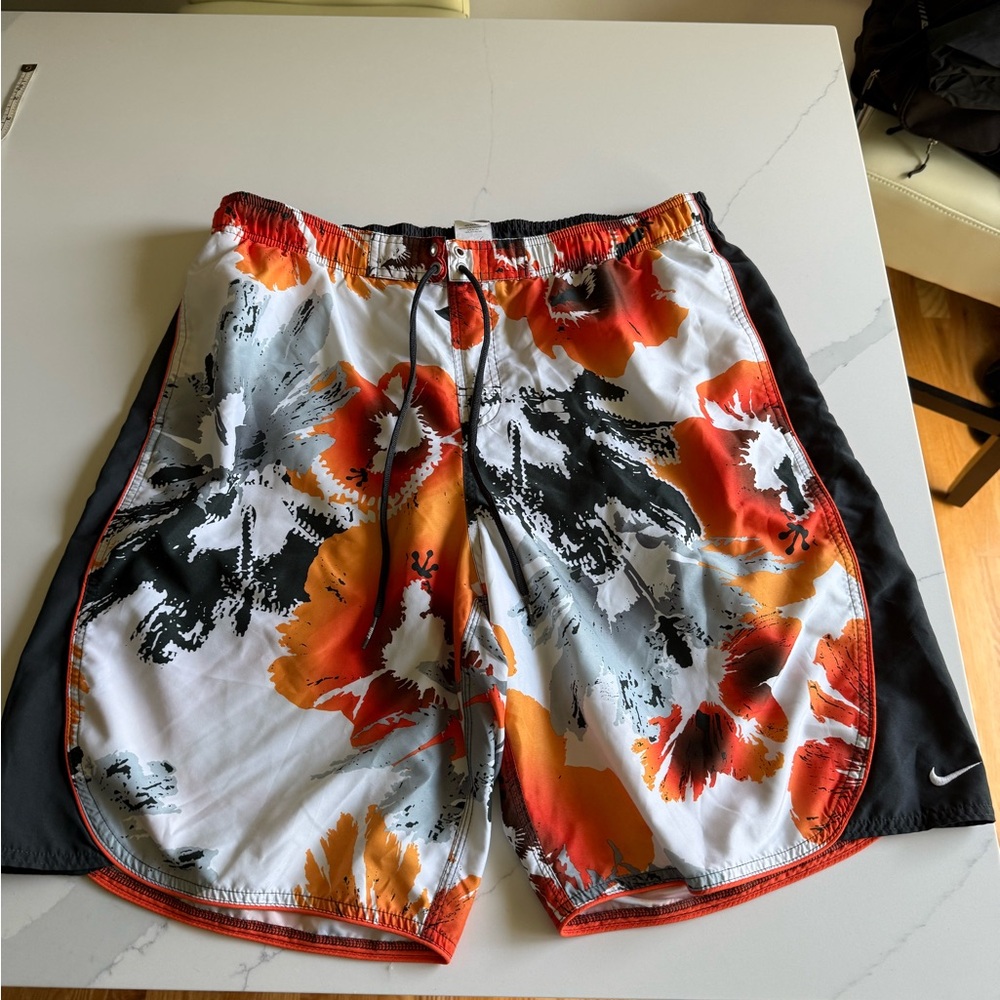 Nike Red and Orange Board Shorts with Dynamic Design